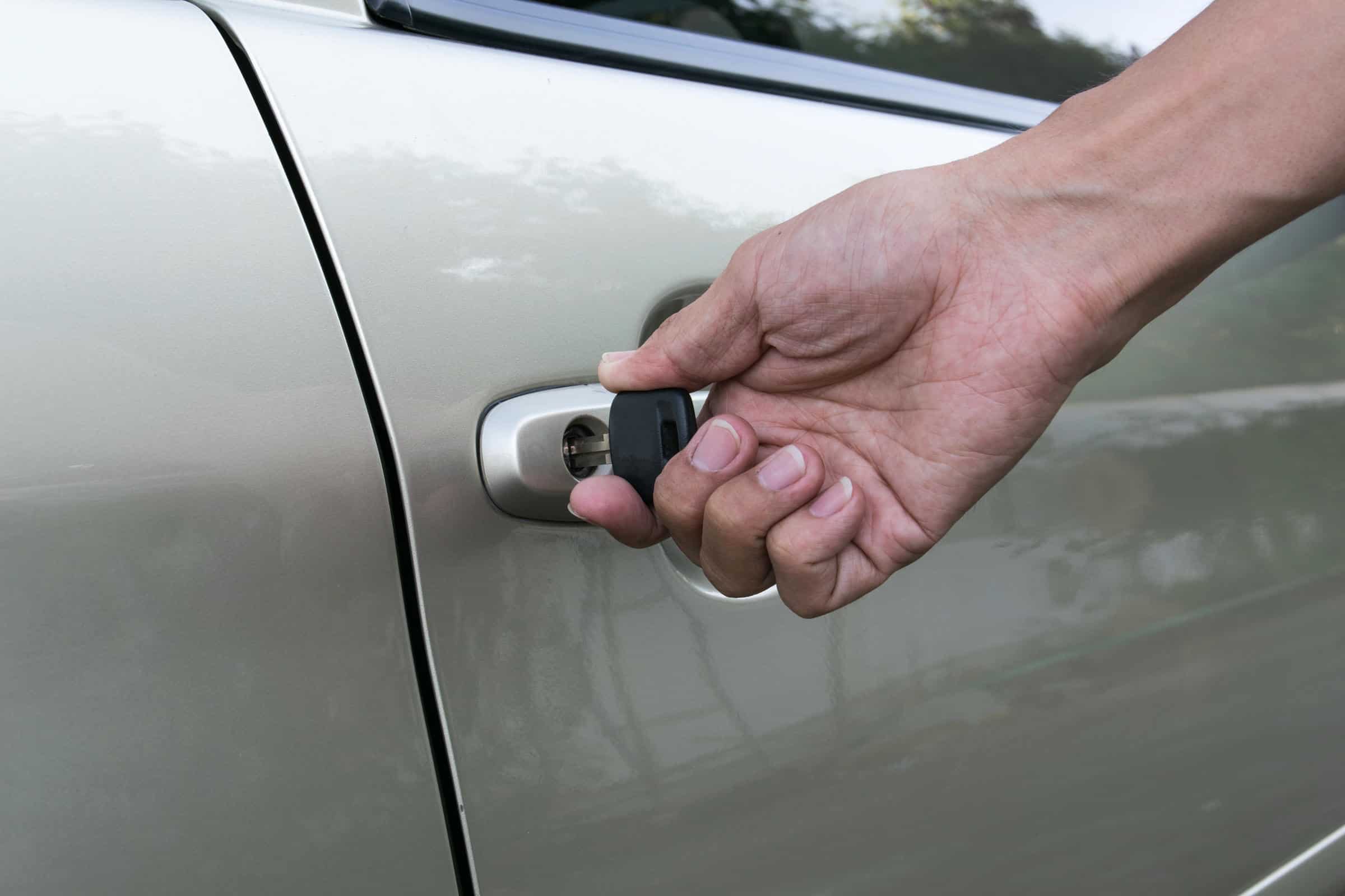 Locksmith working on a car door